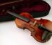An open instrument case with accessories