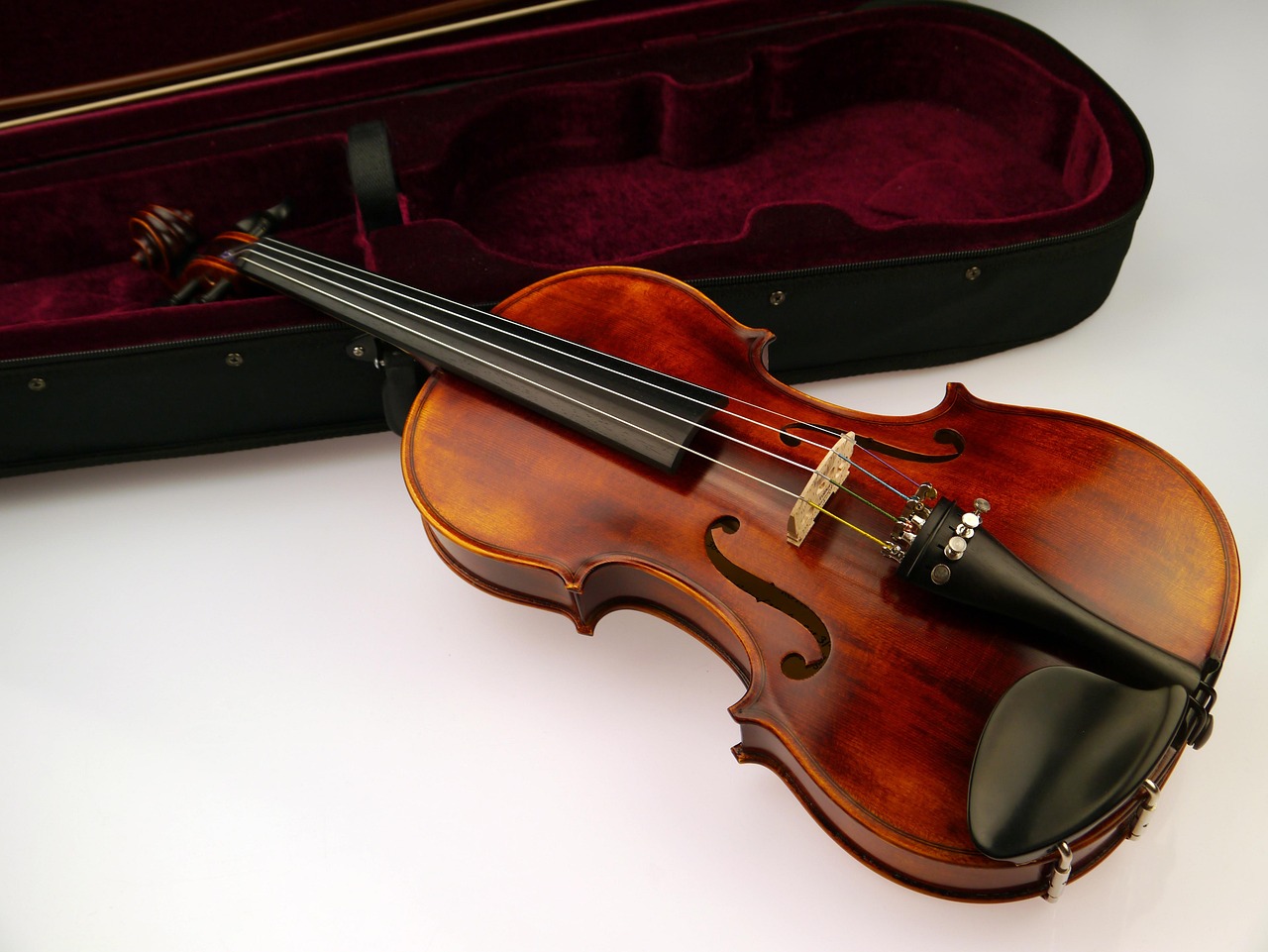 An open instrument case with accessories